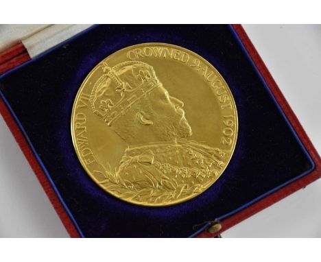 An Edward VII Coronation 1902 gilt metal medallion, diameter 55mm, boxed.