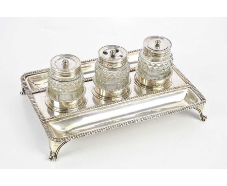 SAMUEL &amp; GEORGE WHITFORD; a George IV hallmarked silver desk stand, with cast rim and scrolling feet, London 1826, with p