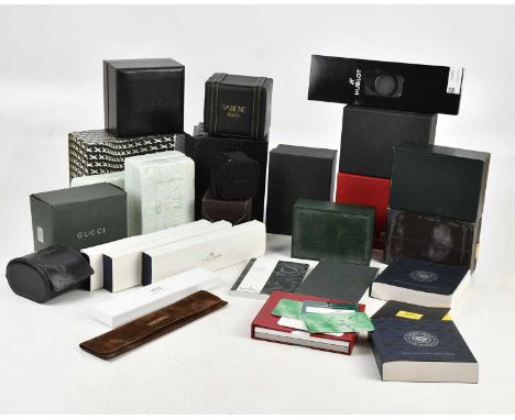 A large collection of empty wristwatch boxes and paperwork, various brands including Breitling, Longines, polystyrene Rolex e