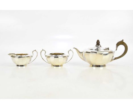 ELKINGTON &amp; CO; a George V hallmarked silver three piece tea service with panel decoration, Birmingham 1919, approx 30ozt