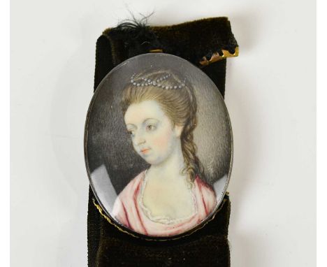X A 19th century portrait miniature on ivory bracelet depicting a maiden, portrait size 35 x 27mm, with cloth bracelet.SH4WVD