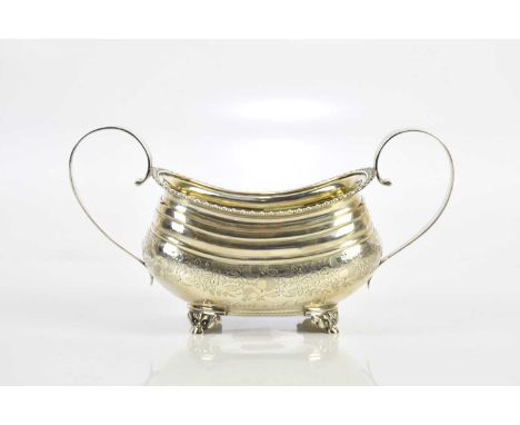 HENRY NUTTING (PROBABLY); a George III hallmarked silver twin handled sugar bowl with bright cut decoration and gilt interior