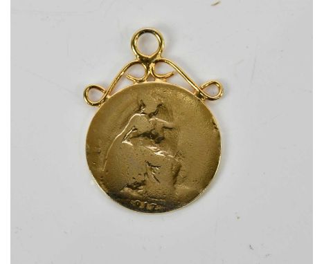 A yellow metal pendant in the style of a sovereign, with the side profile portrait of George V, with mount, approx 5.9g.