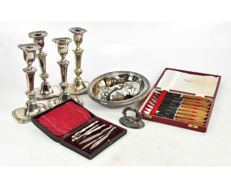 A collection of assorted silver plate, including a set of four candlesticks, flatware, cruet, etc (qty).