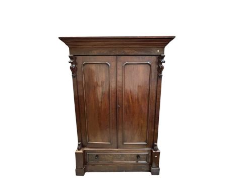 A large Victorian mahogany wardrobe with fitted interior and a single drawer to the base, height 220cm, width 167cm, depth 72