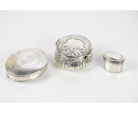 A French silver snuff box of oval form, with chased geometric and linear decoration, a Continental silver pill box of circula