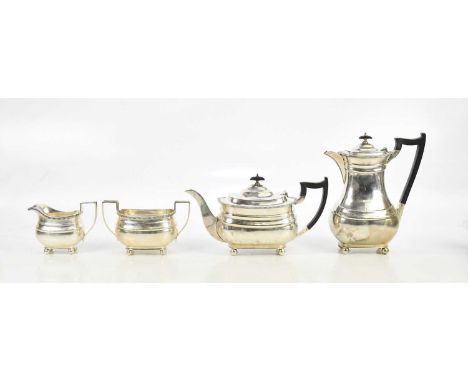 WILLIAM HUTTON &amp; SONS; a George V hallmarked silver four piece tea service with cast beaded rim, Sheffield 1932, combined
