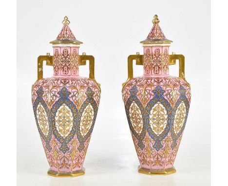 CROWN DERBY; a pair of large and impressive twin handled lidded octagonal vases in the Persian style, shape no. 557, finely d