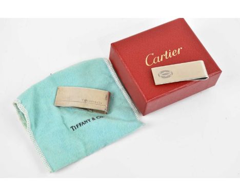 CARTIER; a sterling silver money clip, boxed, and a Tiffany &amp; Co sterling silver money clip, with hinged back (2).Conditi