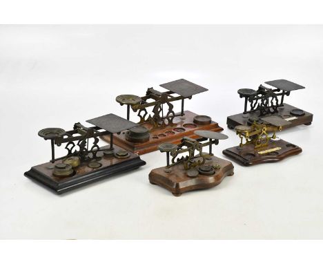 Five sets of Post Office balance scales, including an example with label 'Any letter exceeding 12oz will be liable to postage