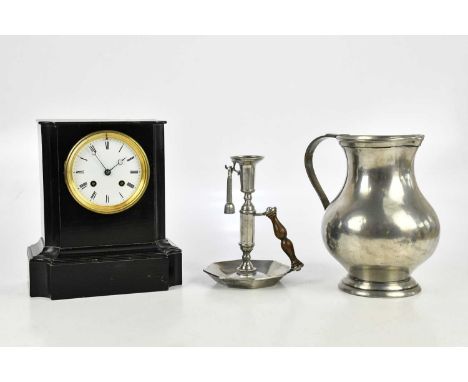 A late Victorian French ebonised mantel clock, the enamel dial set with Roman numerals, height 27cm, a pewter baluster shaped