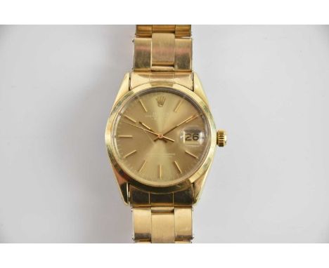 ROLEX; a gentleman's 1980s gold plated Oyster Perpetual Datejust wristwatch, with baton markers to the champagne dial, and wi