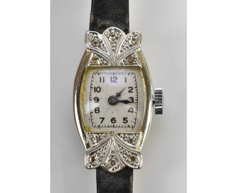 A lady's Art Deco 18ct white gold and diamond set watch, the tonneau shaped dial set with Arabic numerals, on replacement bra