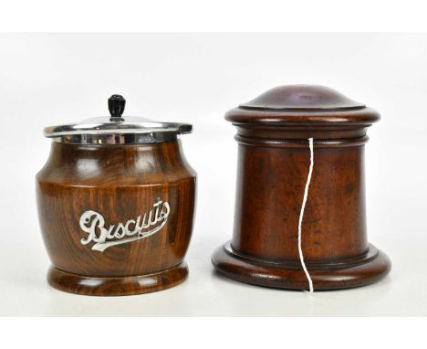 A 19th century treen string box of cylindrical form, height 17cm, and a mid 20th century biscuit box with ceramic liner (2).