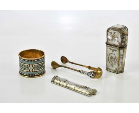 A Scandinavian sterling silver and enamel napkin ring with gilded interior, a similar pair of sterling silver gilt and enamel
