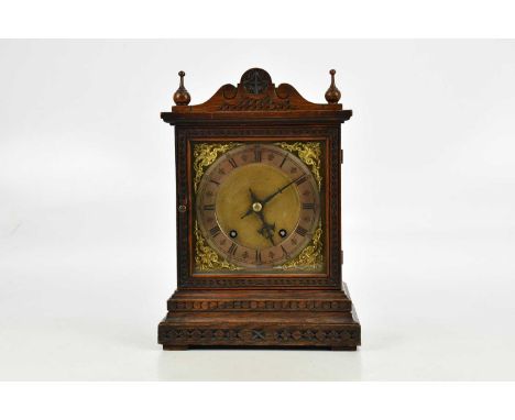 A German oak cased eight day mantel clock, height 30cm.