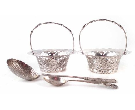 Two Chinese silver pierced baskets and a spoon by Wang Hing and Co. one basket depicts a dragon, the other depicts chrysanthe
