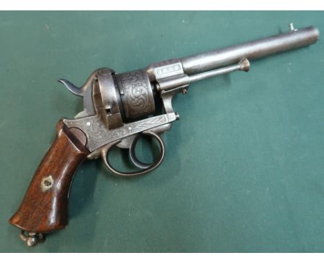 Six shot pinfire revolver c. 1860. Continental, possibly German.  15cm (6?) round barrel.  Foliate decorated, steel frame, tr
