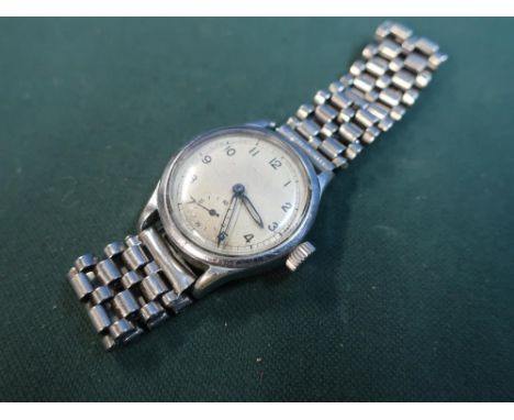 Military wristwatch with reverse broad arrow mark A.T.P 220024 - 37201 with metal bracelet 