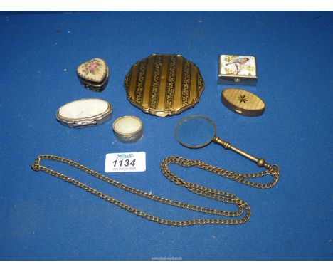 A Stratton compact, lorgnette on a chain and five pill boxes.