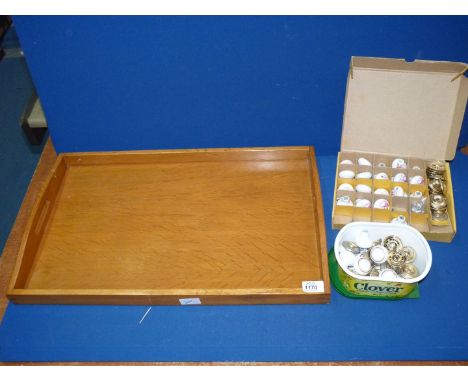 A quantity of ceramic door knobs with back plates and a large lightwood tray with green baize covered base, 24" x 15".
