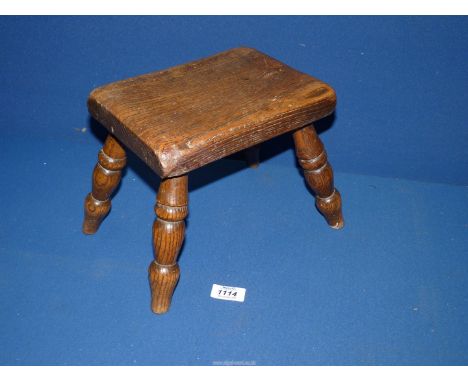A small Footstool with bobbin turned splayed legs, 11 1/2" wide x 7 1/2" depth x 8" high.