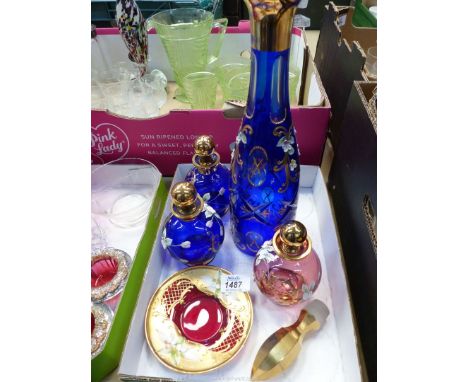 A small quantity of colourful Bohemian hand painted floral enamel and gilded items including a tall cobalt blue decanter and 