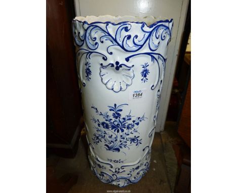 A Continental blue and white ceramic stick stand with raised decoration  18" tall x 81/2" diameter.