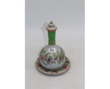 An uncommon pale puce matte ground pottery narrow-neck flask/carafe decorated with glaze-applied trailing Peony blooms and fo