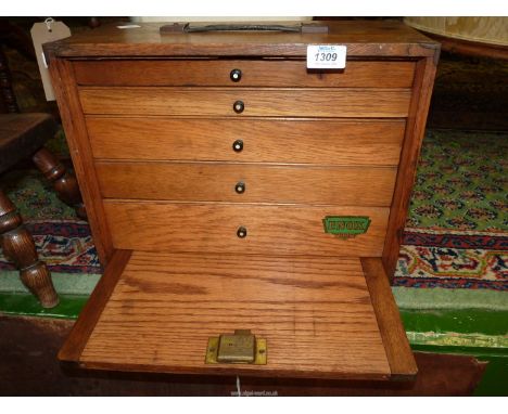 An Enox wooden tools cabinet with five graduated drawers, with key, 16'' w x 7 1/2'' d x 12'' high.