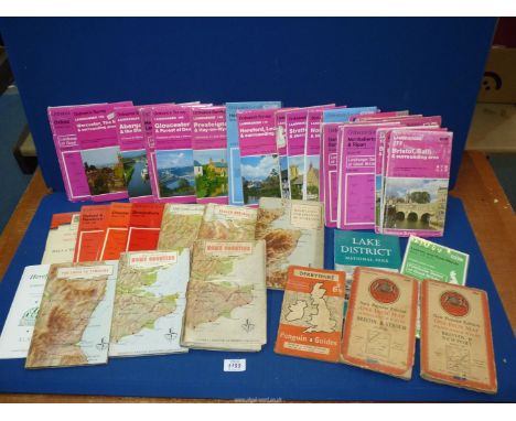A quantity Ordnance Survey maps and travel book.