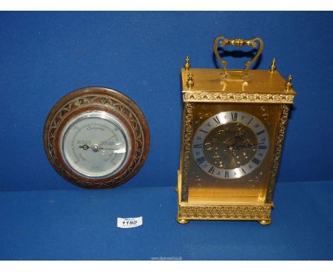 A quartz carriage Clock by London Clock Company and a Smiths Barometer.