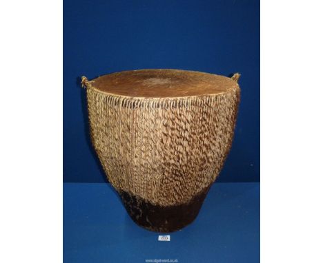 A large bongo Drum, 17 1/2" diameter x 19 1/2" high.