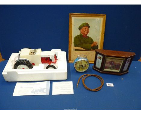 Two souvenir Chinese clocks and a picture of the Peoples Republic of China, together with a model 1953 Ford Jubilee Tractor, 