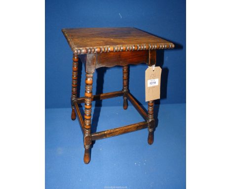 An Art Nouveau occasional Table by George Fleet & Co. (agents for Liberty's), standing on bobbin turned legs, 11" square x 15