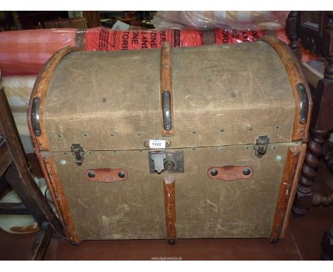 A well travelled bentwood bound Canvas Trunk having an arched top, the remains of old travel labels including "Isle of Wight 
