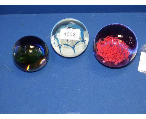 Three  large Caithness paperweights to include: "Intrigue 281-750, "May dance" and another with earlier mark.