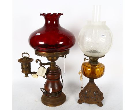 An Antique cast-iron oil lamp, with amber font and etched glass shade, 50cm, and a wooden oil lamp, with ruby glass shade con