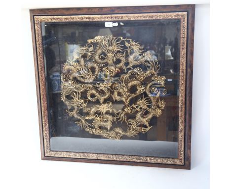 A large Chinese resin dragon and pearl roundel, framed, overall 82cm x 82cm 