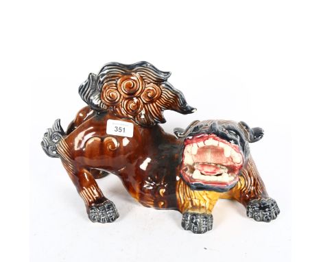 A Chinese ceramic glazed dog of fo (tongue broken), length 35cm 