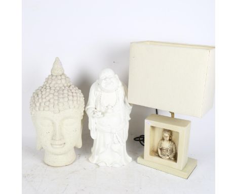 A composite Buddha's head, a plaster figure of a sage, and an Oriental design table lamp and shade (3) 