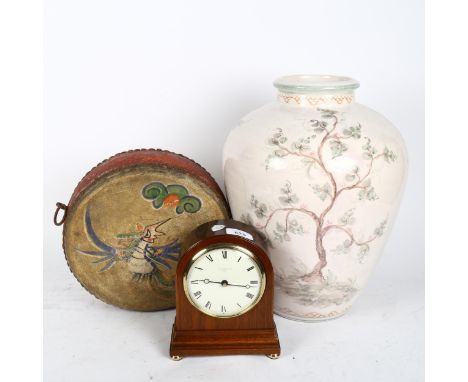COMITTI - a mahogany-cased dome-top quartz mantel clock, a painted ceremonial drum, and a large ceramic baluster vase (3) 