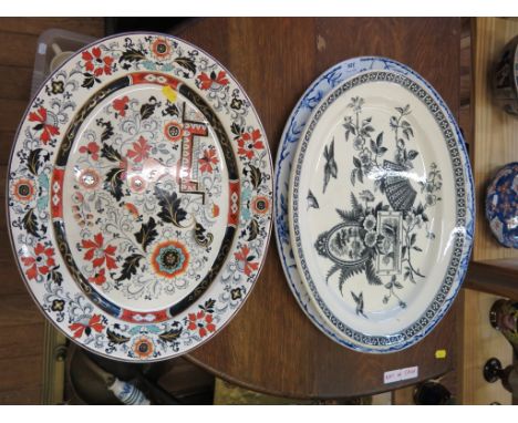 Three large oval stoneware dishes comprising Ashworth Imari pattern and two others