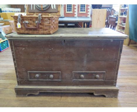 A painted pine chest, the hinged lid over two false drawers on bracket feet, 109cm wide