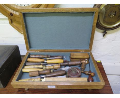 Various chisels, corkscrews and woodwork tools, in a baize lined box