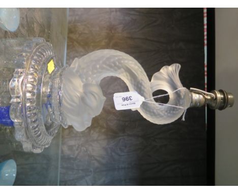 A Baccarat glass table lamp in the form of a dolphin, on a shaped circular base, 25cm high
