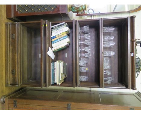 A stained oak Globe Wernicke stacking bookcase, the four sections with glazed fall fronts over a long drawer, 87cm wide, 166c