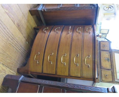 A George III style bowfront chest, with five graduated long drawers on bracket feet, 63cm wide