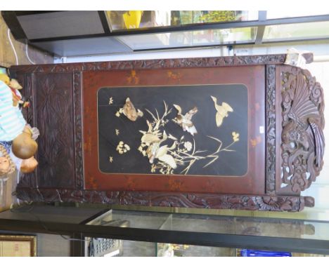 A Japanese two fold screen, the lacquer Shibayama style panels inset in mother of pearl to depict birds, within a bird and fo