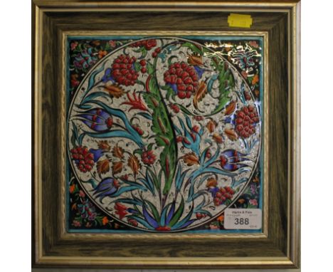An Iznik design handmade ceramic tile 20cm x 20cm mounted in frame